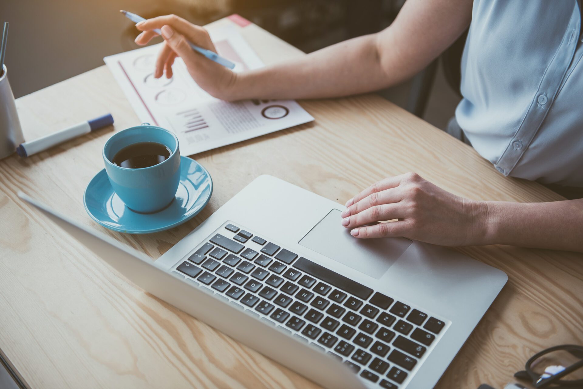 Woman arms using digital device at work Financial Statement Engagements